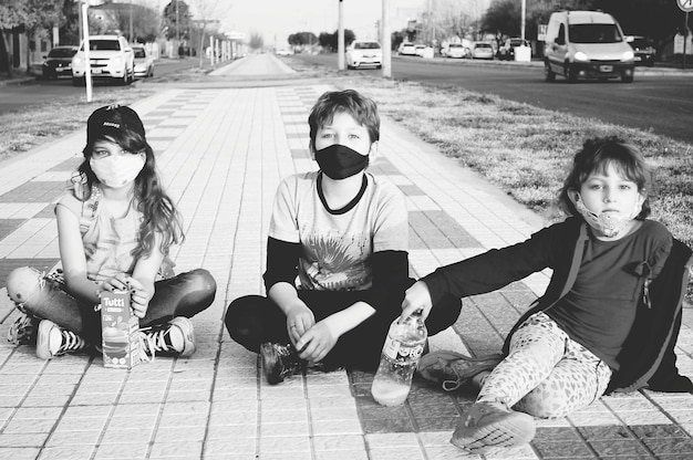 A split image showing Stray Kids on one side in their signature edgy style, and a shadowed figure representing a potential US collaborator on the other, with a question mark in the middle to symbolize the mystery.