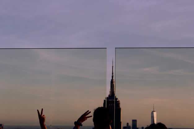 A screengrab showing a split-screen view of aespa performing in both the real world and the metaverse during their virtual concert. The image illustrates the seamless integration and synchronization of their physical and digital personas, highlighting the unique visual experience offered to viewers.