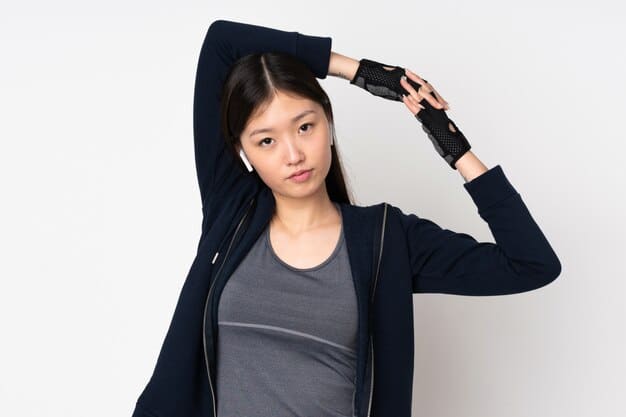 A K-Pop idol looking exhausted and wiping sweat from their brow after a performance, with the stage lights blurred in the background, visually conveying the physical toll of performing while on a restrictive diet.