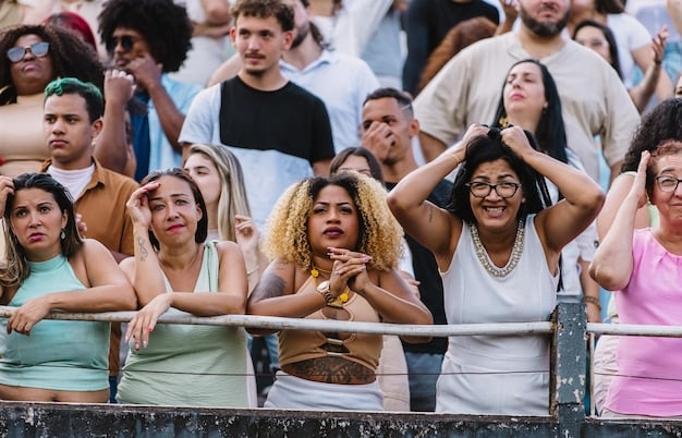 A group of diverse fans in the US recreating a dance routine from a popular J-Pop music video. Focus on the energy and enthusiasm of the fans.