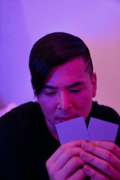 A close up, eye-level shot showing a young US K-pop fan typing a supportive and respectful message on a smartphone, with a K-pop idol's performance visible on the screen in the background.