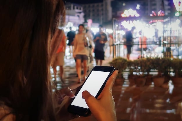 A fan carefully examining a digital concert ticket on their smartphone screen, with a blurry background of a crowded concert venue entrance.